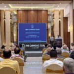 An informational meeting and presentation for The Catholic Club Mangalore held before an audience at the Goldfinch Hotel.